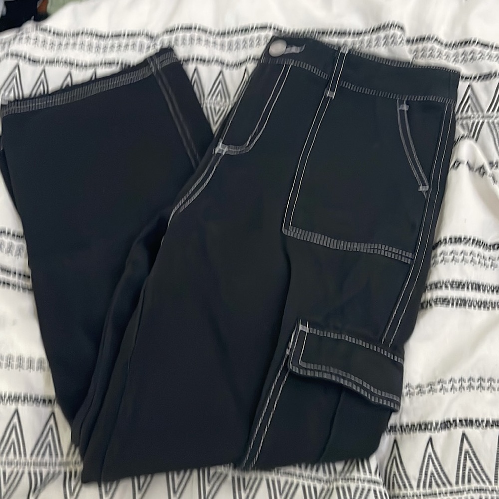 This is Full Tilt Cargo from Tilly’s!It is black with white outlines on pockets!